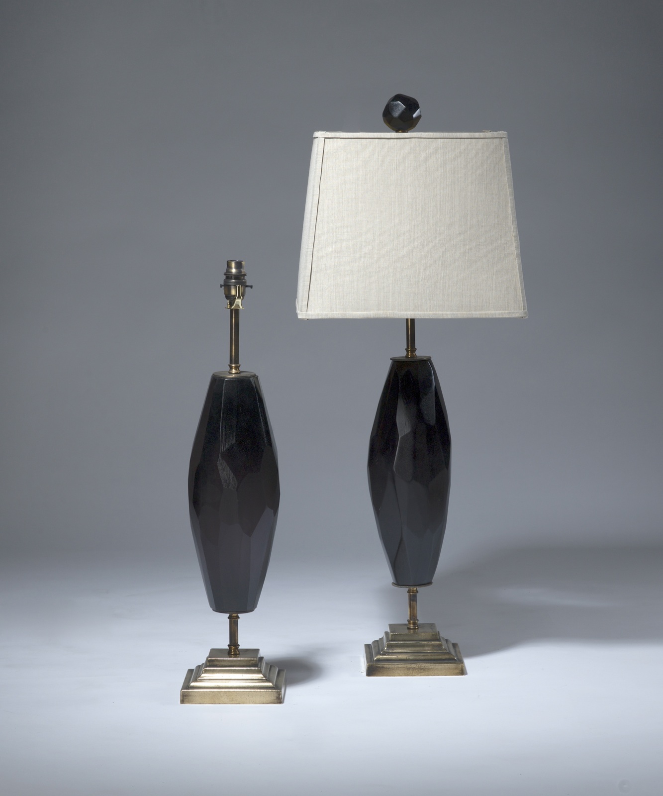 Pair Of Medium Black Facetted Cut Glass Lamps On Distressed Brass Bases