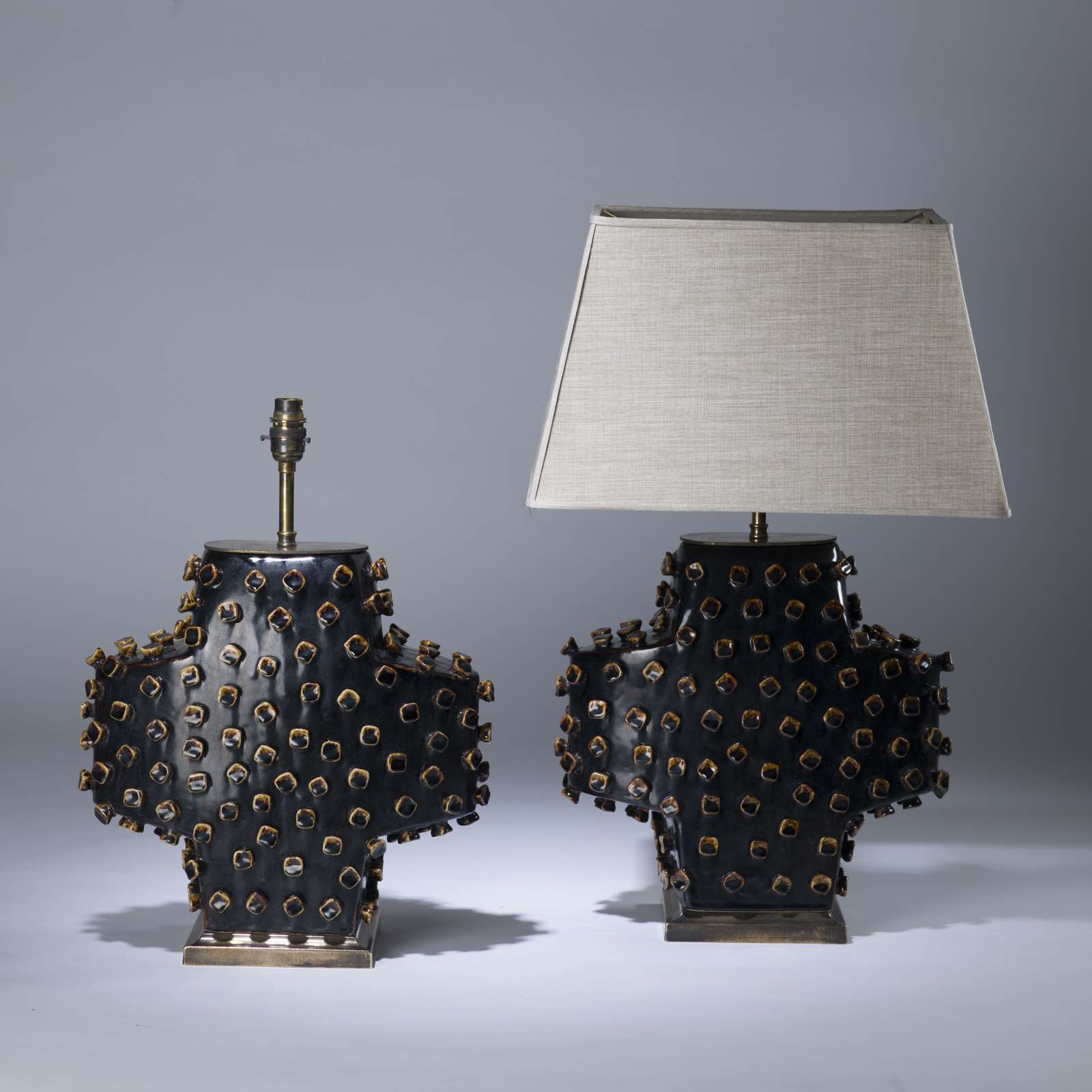 Pair Of Medium Black Ceramic Studded Plus Lamps On Rectangular Brass