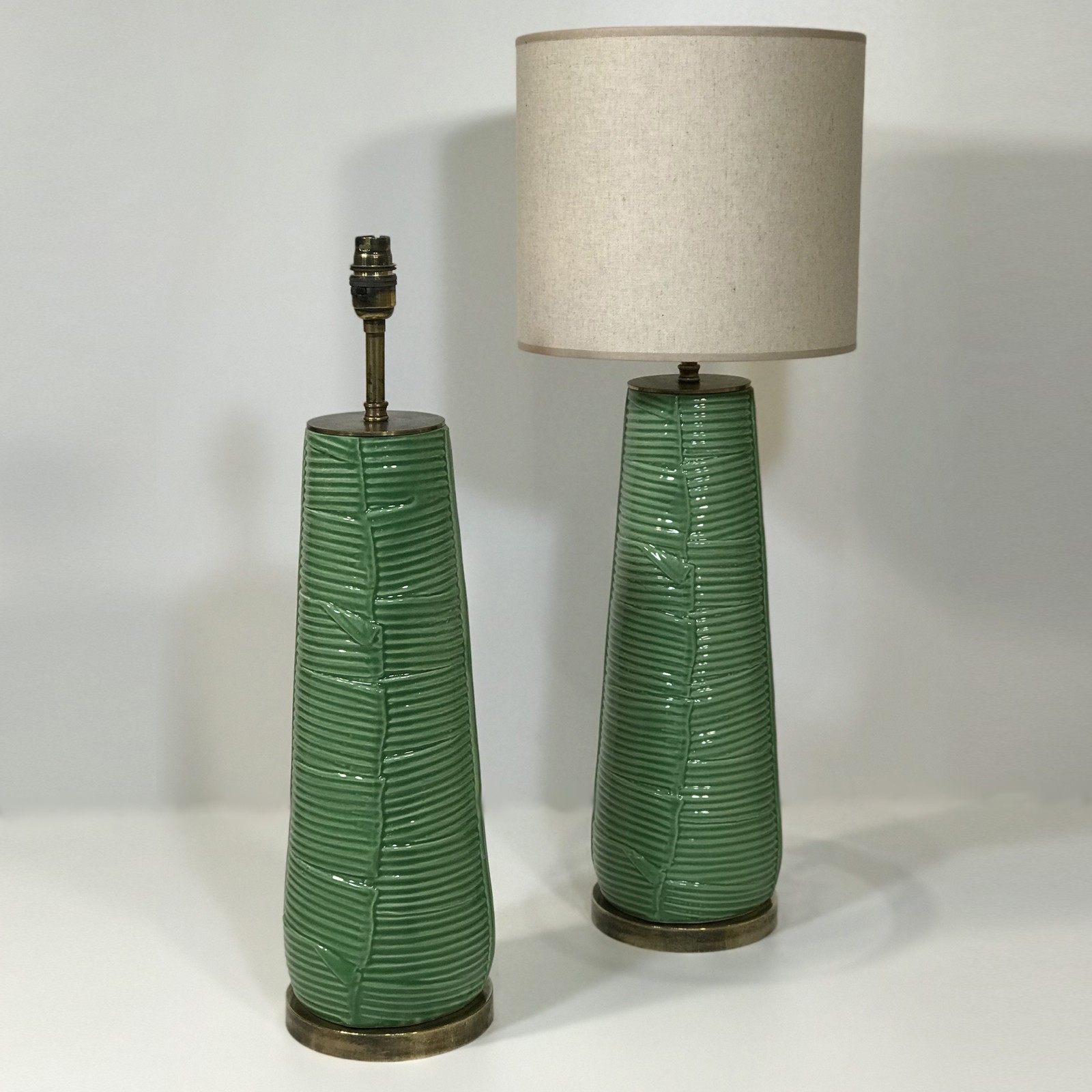 Pair Of Medium Green Ceramic Leaf Lamps On Distressed Brass Bases