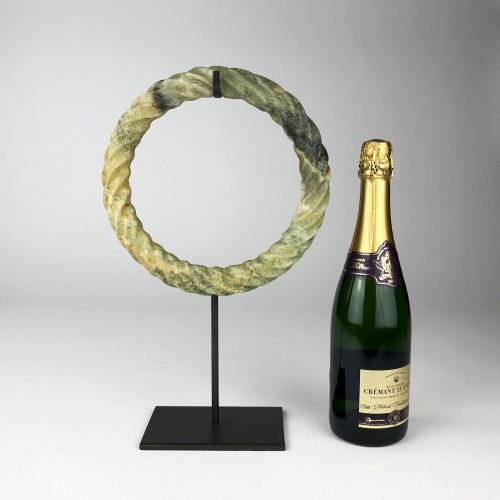 Green Stone Hoop Ring on Brown Bronze Stand
